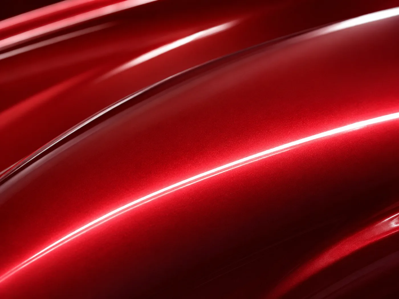 Acabado brillante de pintura roja con sistema bicapa recién aplicada